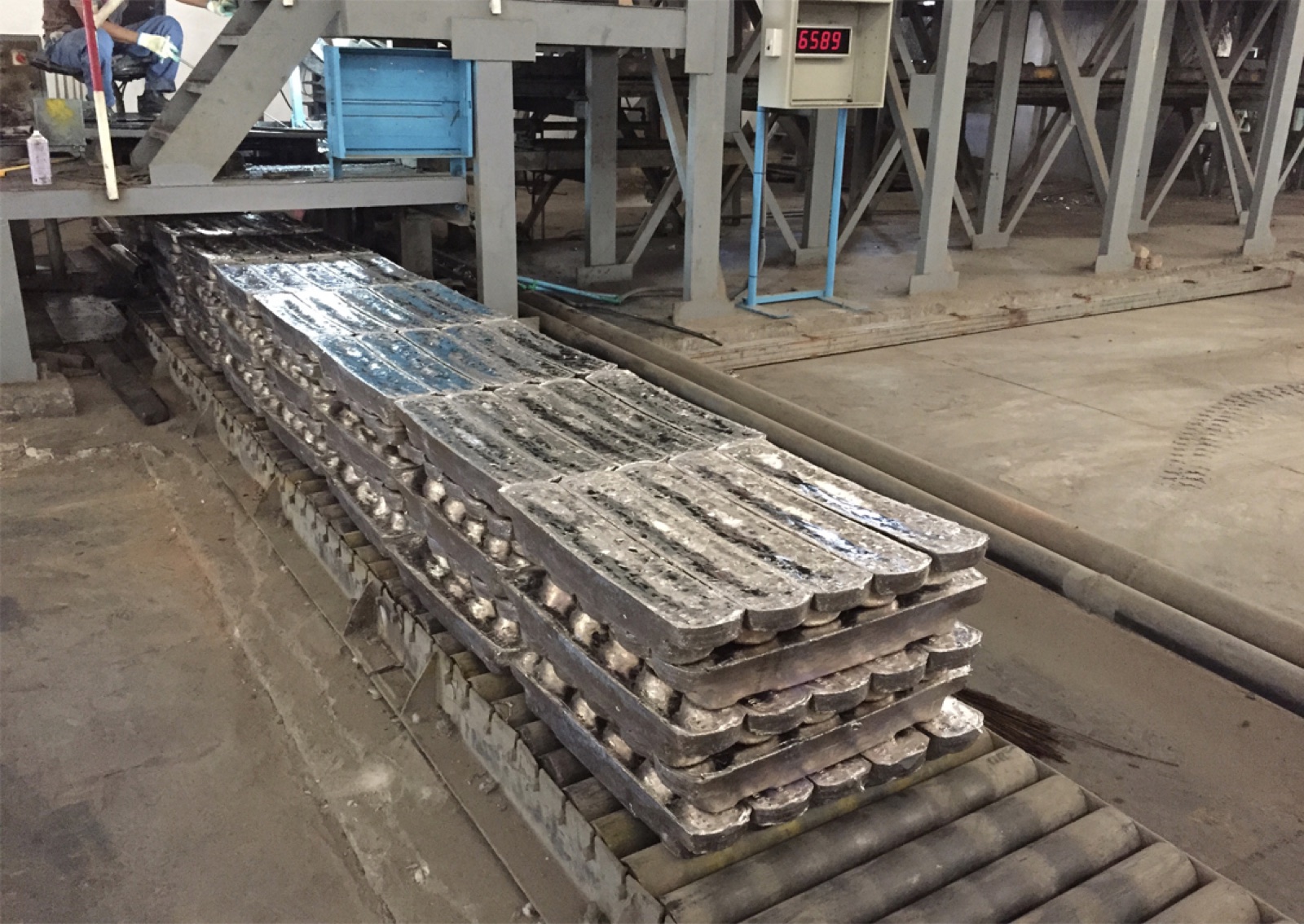 Pure lead ingots on the casting line